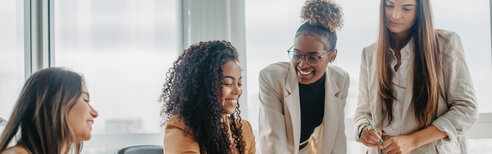 Women Working Together in the Office 3200x1000