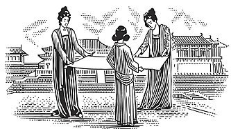 three women standing in a circle holding a long sheet of paper