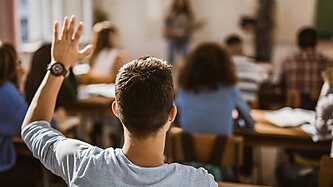 Student raising his hand