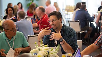 Two men having a discussion at a table