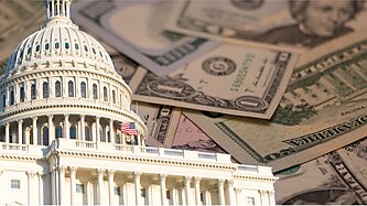 The Capitol building with U.S. paper currency in the background