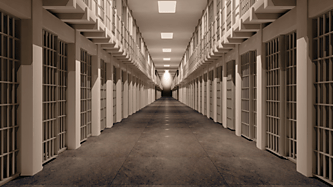 A portrait of a prison hallway